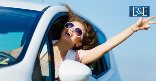woman driving during a summer day