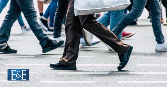 closeup of people's feet crossing street